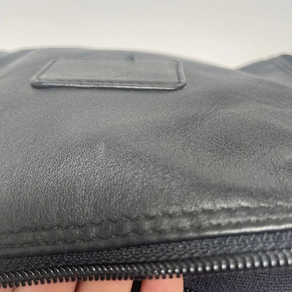 Tumi black leather